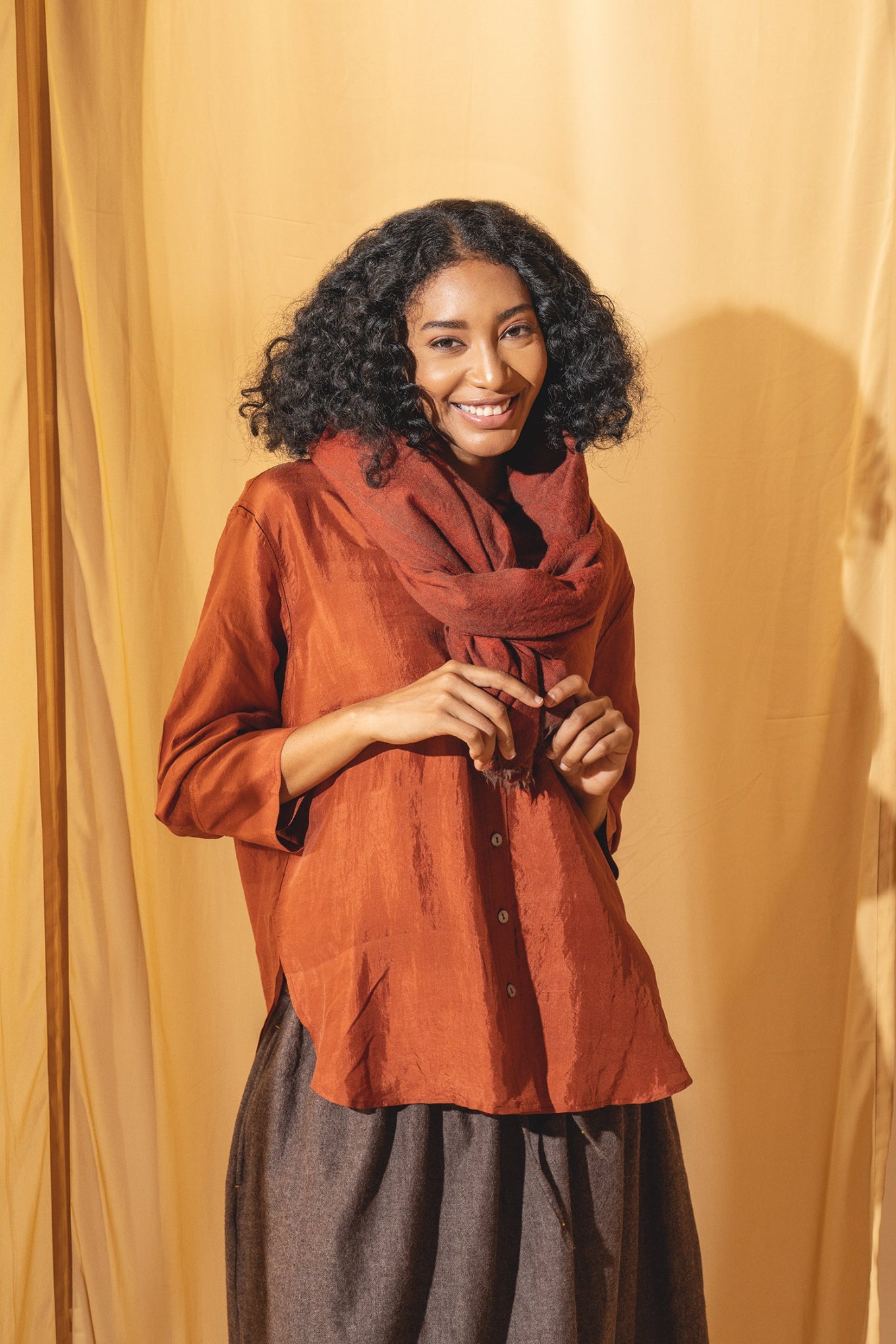Dve Collection Arha silk button up blouse in rust.