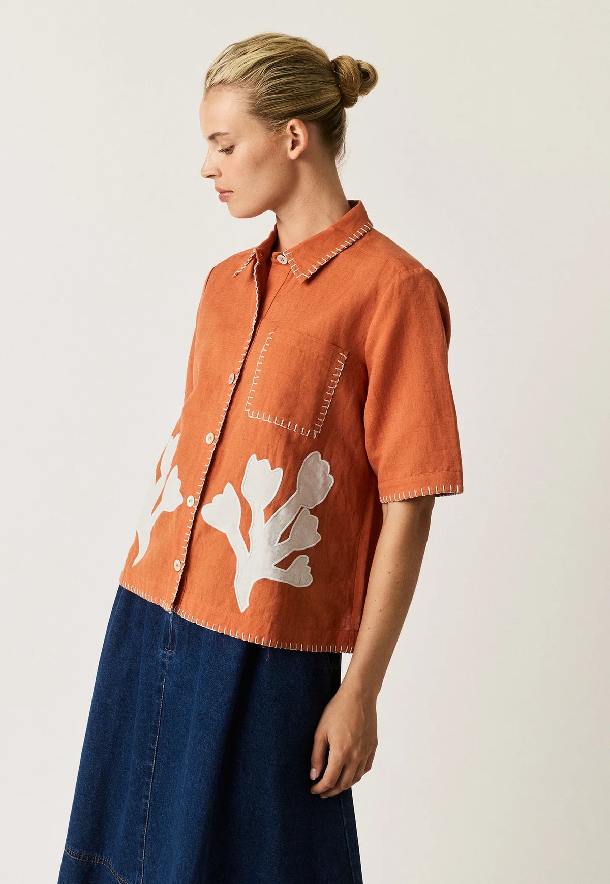 Nancybird Summer shirt applique linen cotton button up with coral shape on orange and contrast buttonhole edge stitching.