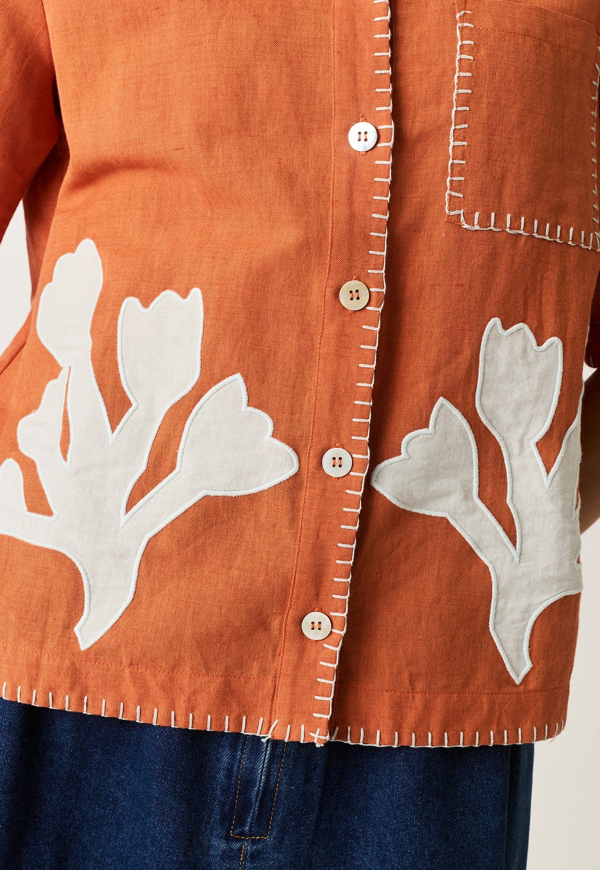 Nancybird Summer shirt applique linen cotton button up with coral shape on orange and contrast buttonhole edge stitching.