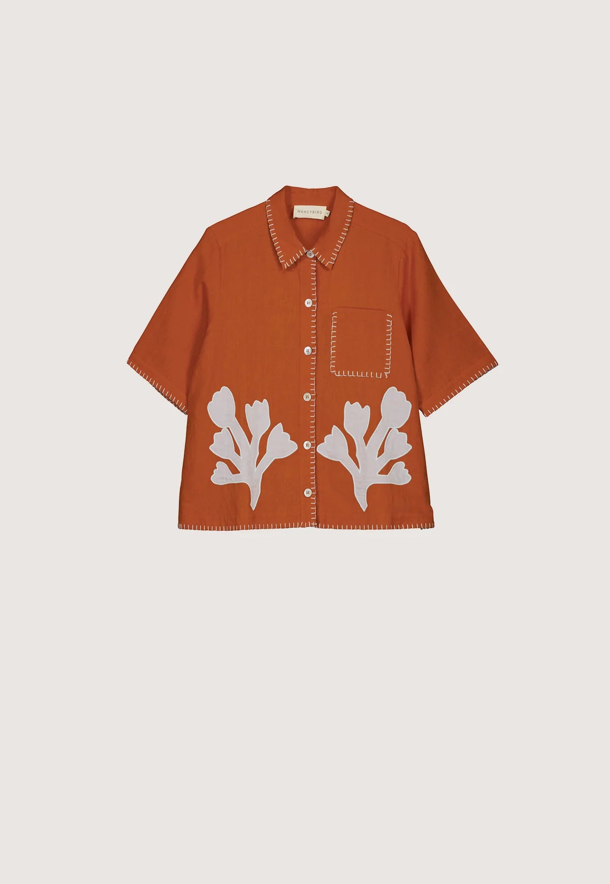 Nancybird Summer shirt applique linen cotton button up with coral shape on orange and contrast buttonhole edge stitching.