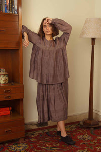 DVE Usha blouse in handloom grey silk with smocked front.