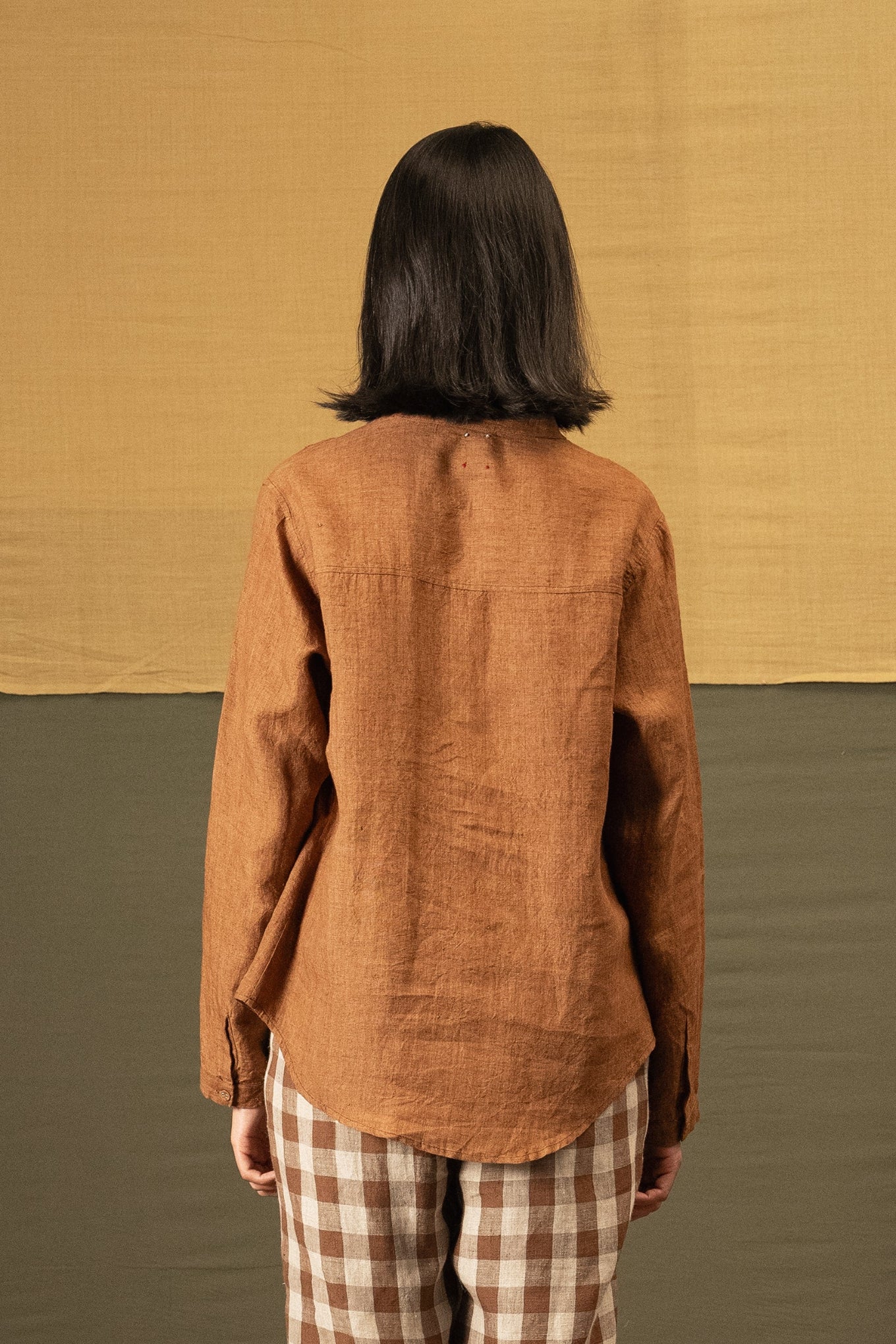 DVE Apa button up collarless linen blouse in French beige tan brown with pintuck and embroidered details.