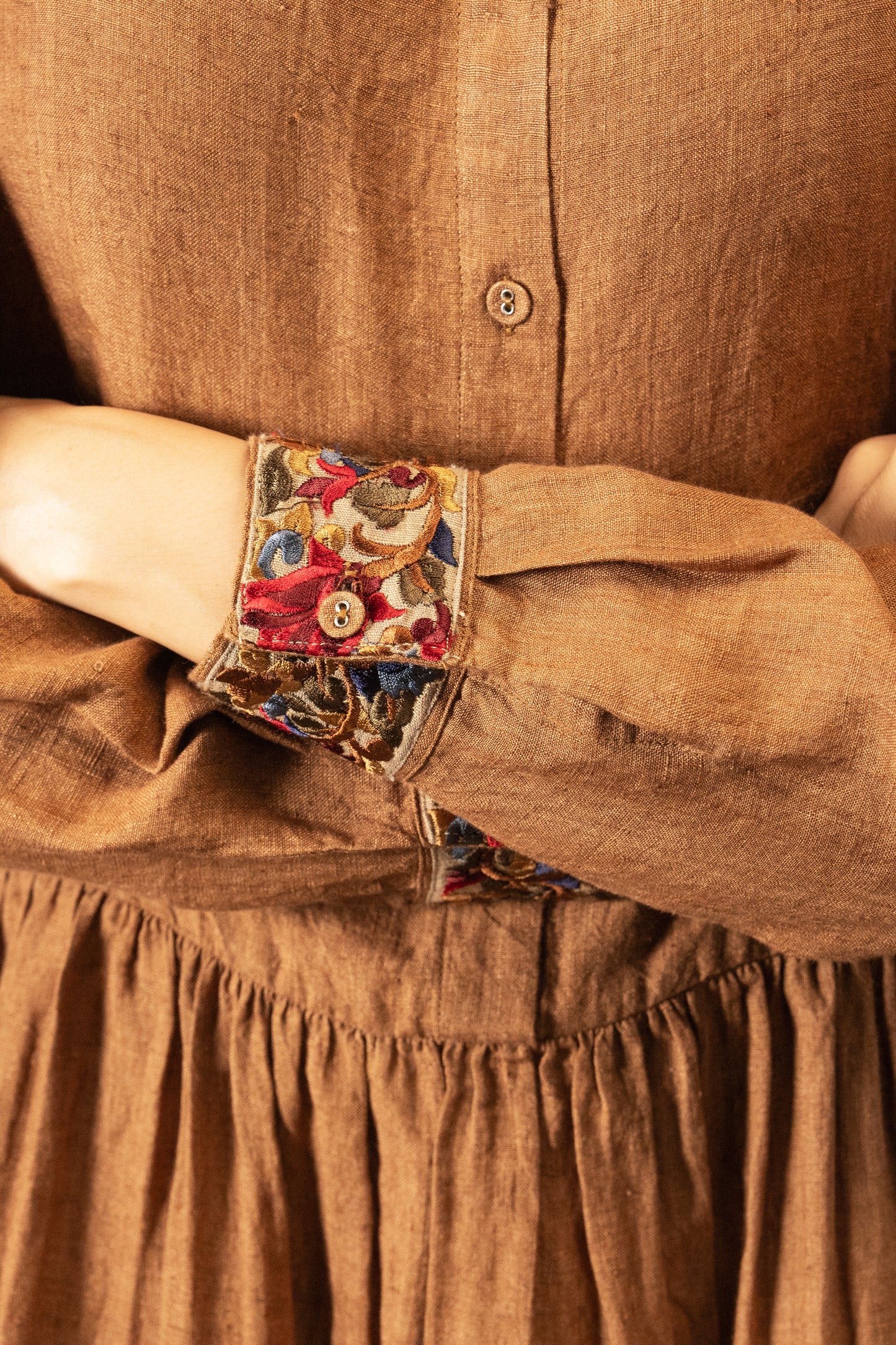 DVE Reeva dress in French beige linen with braid trim - close up.