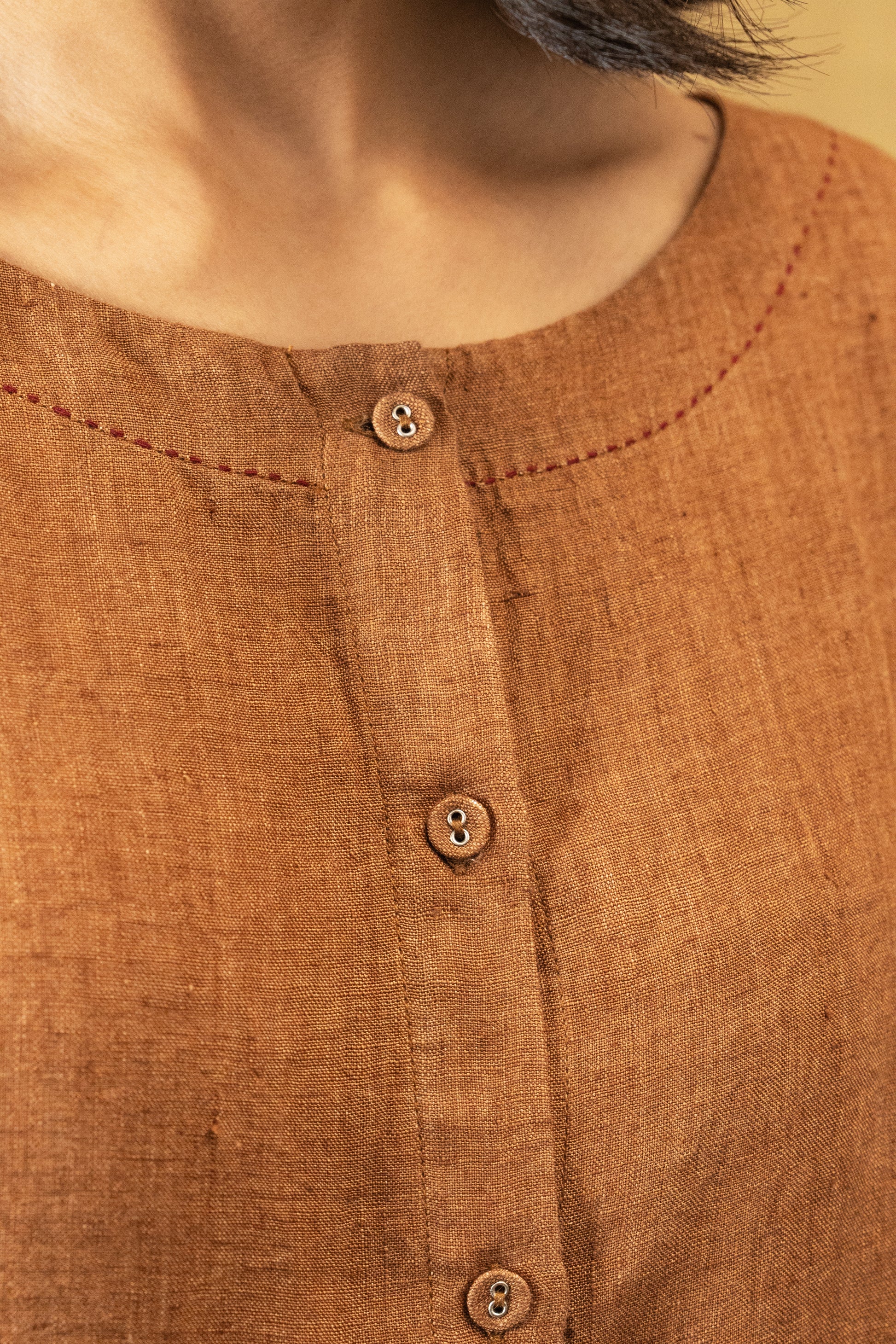 DVE Reeva dress in French beige linen with braid trim.