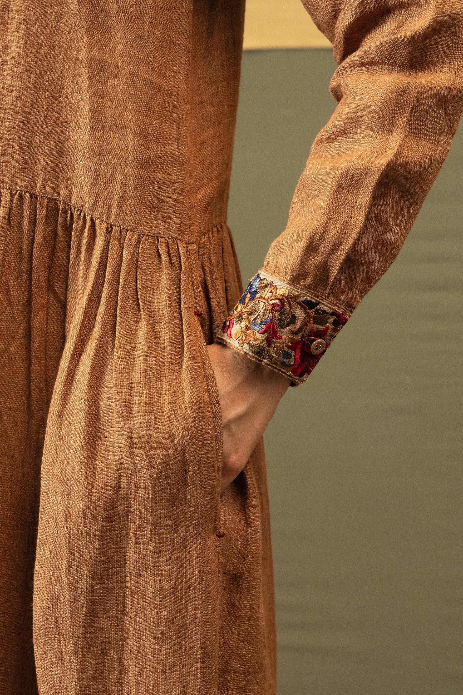 DVE Reeva dress in French beige linen with braid trim.