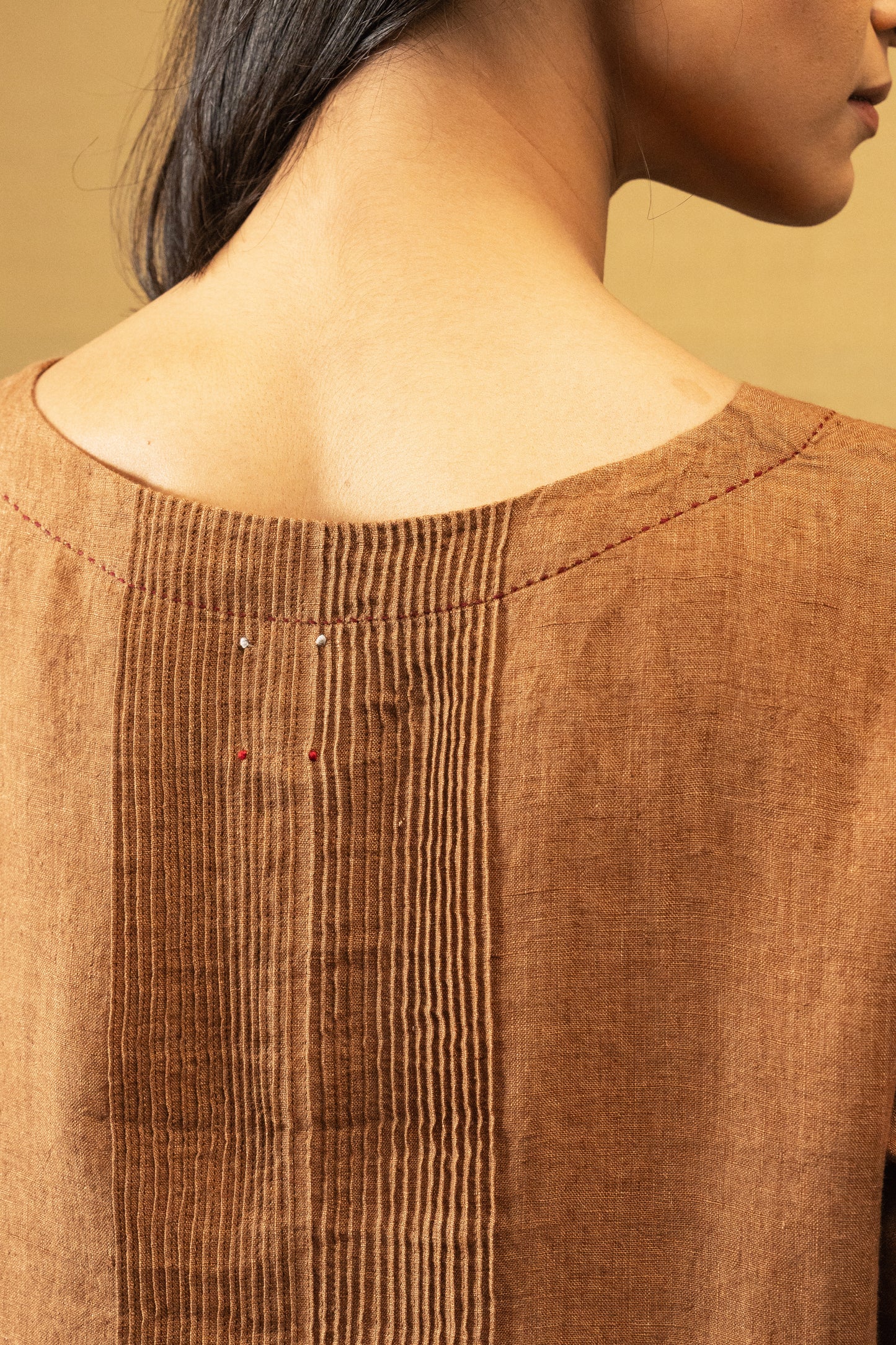 DVE Reeva dress in French beige linen with braid trim.