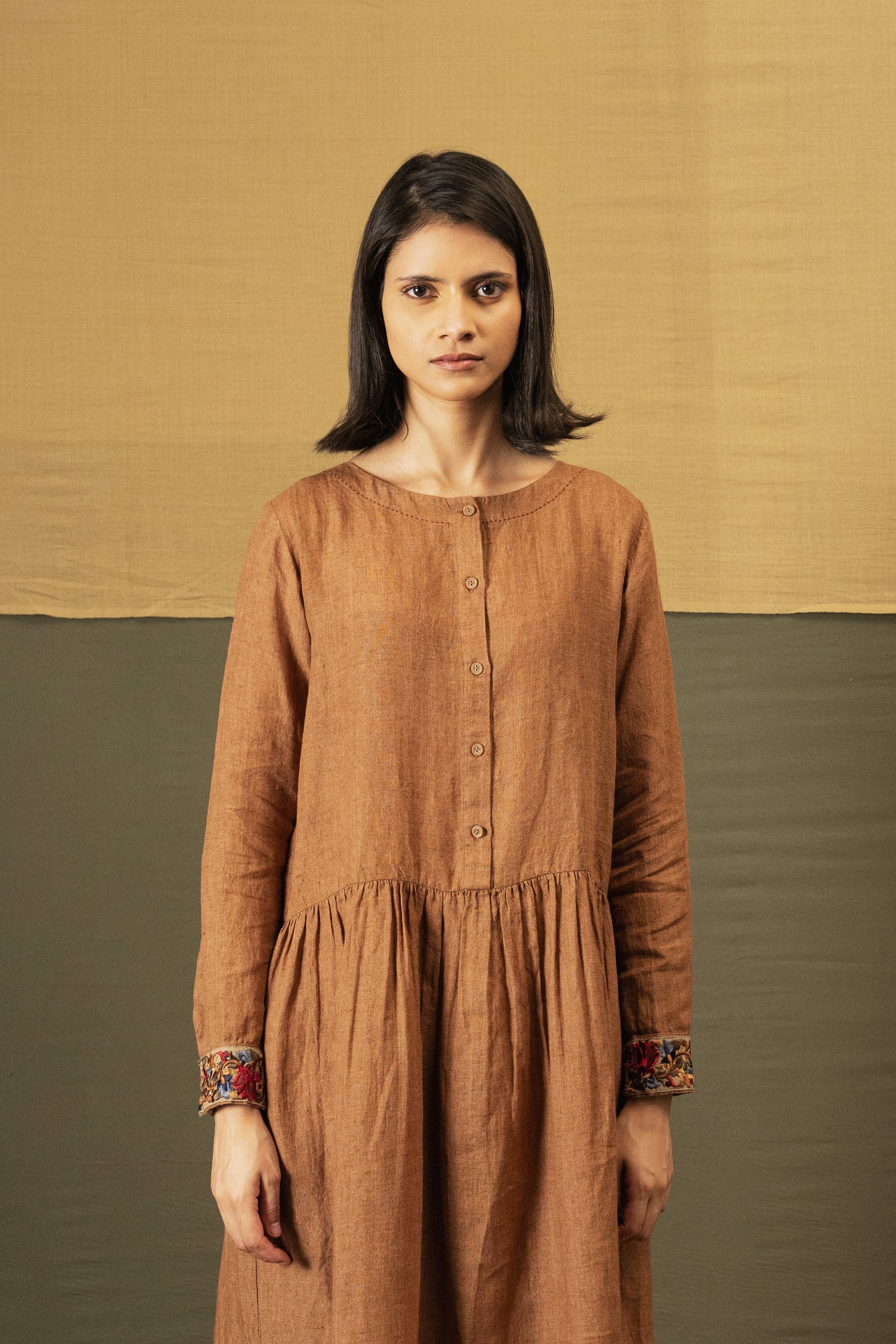 DVE Reeva dress in French beige linen with braid trim.