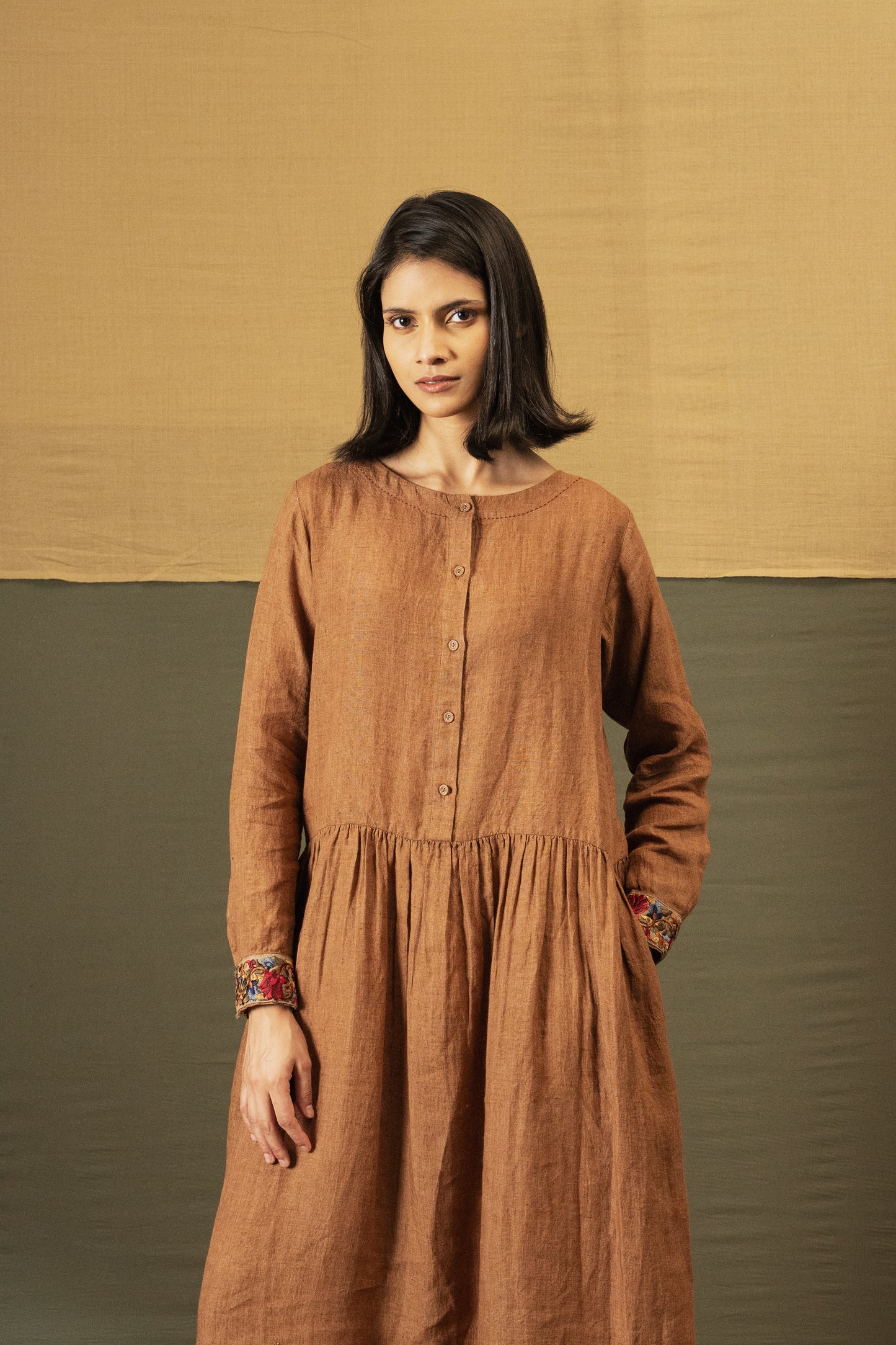 DVE Reeva dress in French beige linen with braid trim.