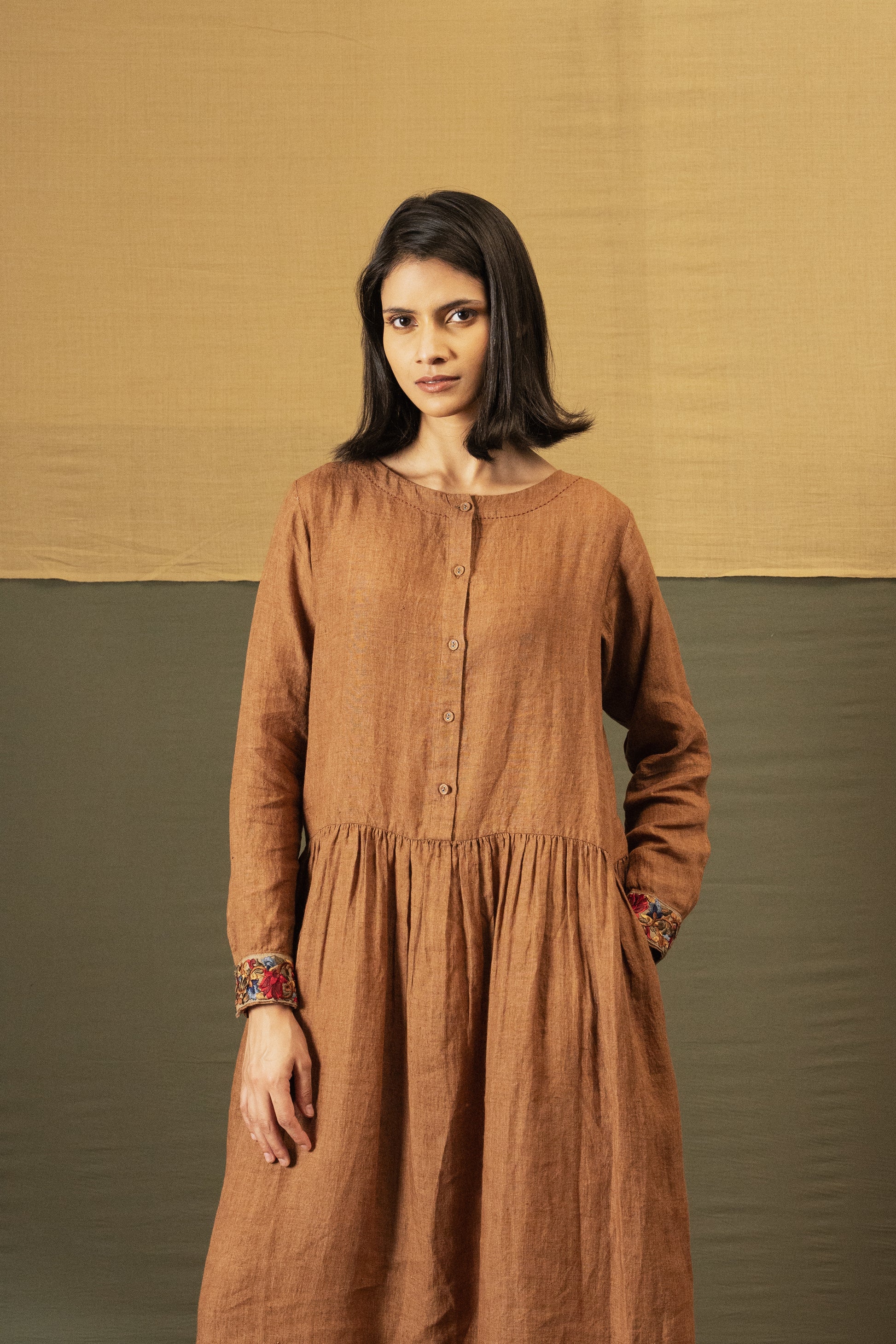 DVE Reeva dress in French beige linen with braid trim.