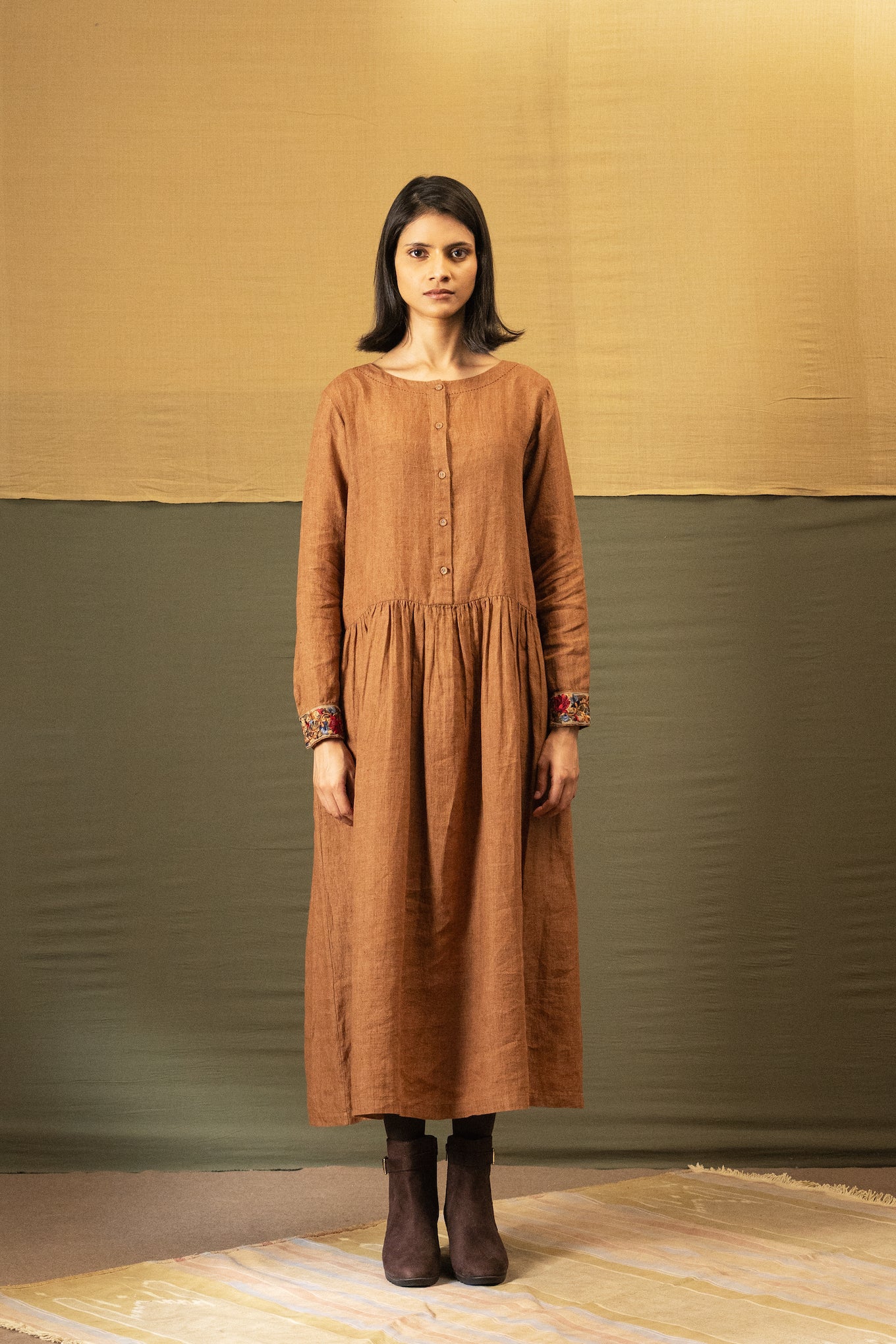 DVE Reeva dress in French beige linen with braid trim.