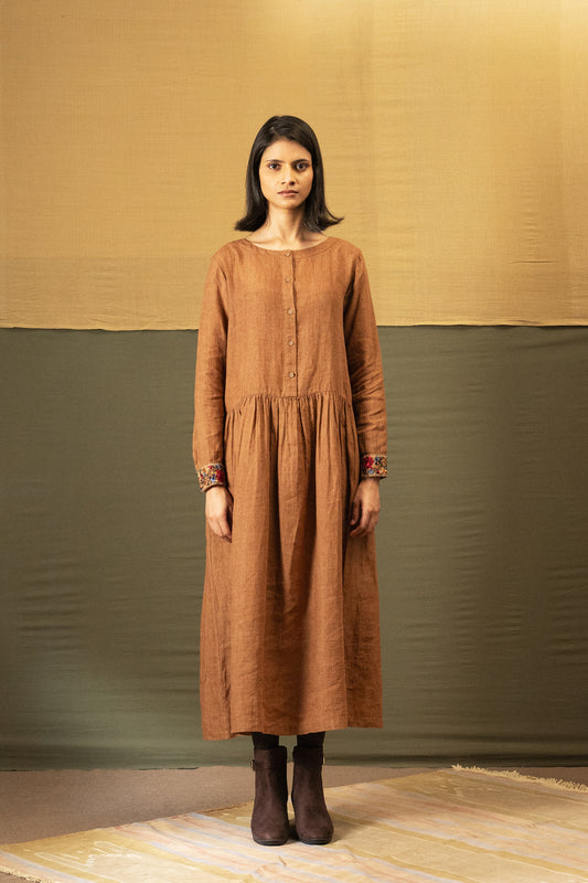 DVE Reeva dress in French beige linen with braid trim.