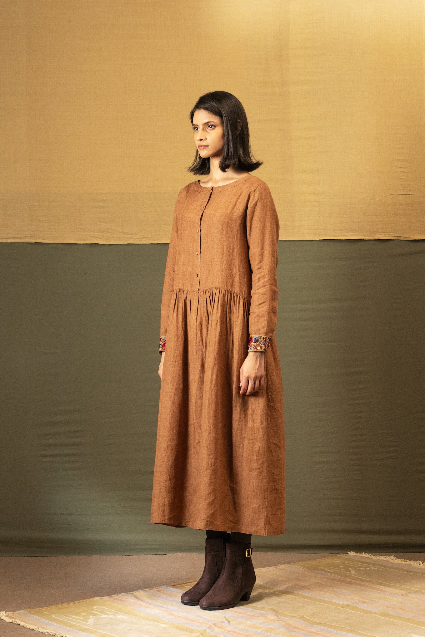 DVE Reeva dress in French beige linen with braid trim.