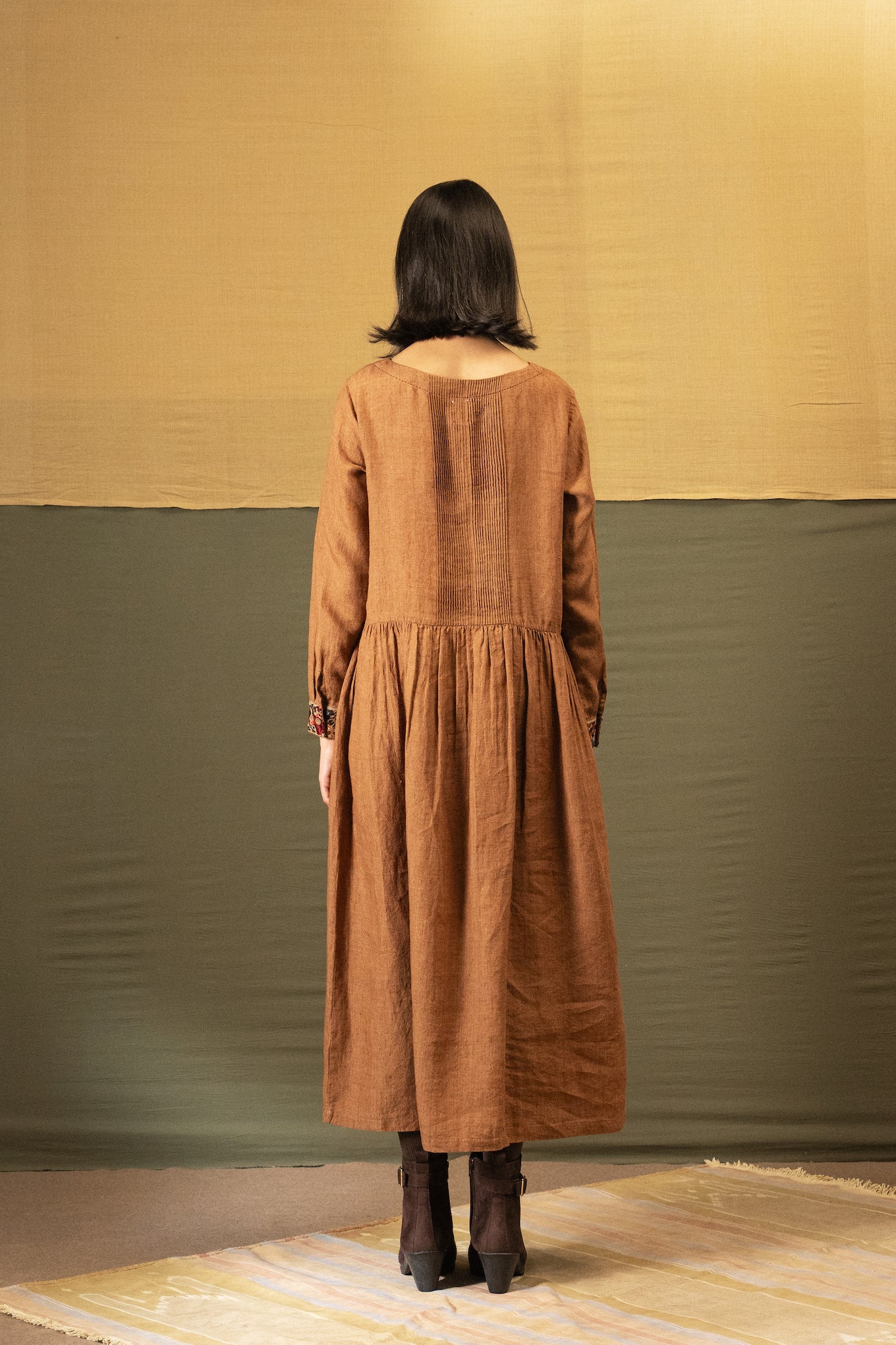 DVE Reeva dress in French beige linen with braid trim.