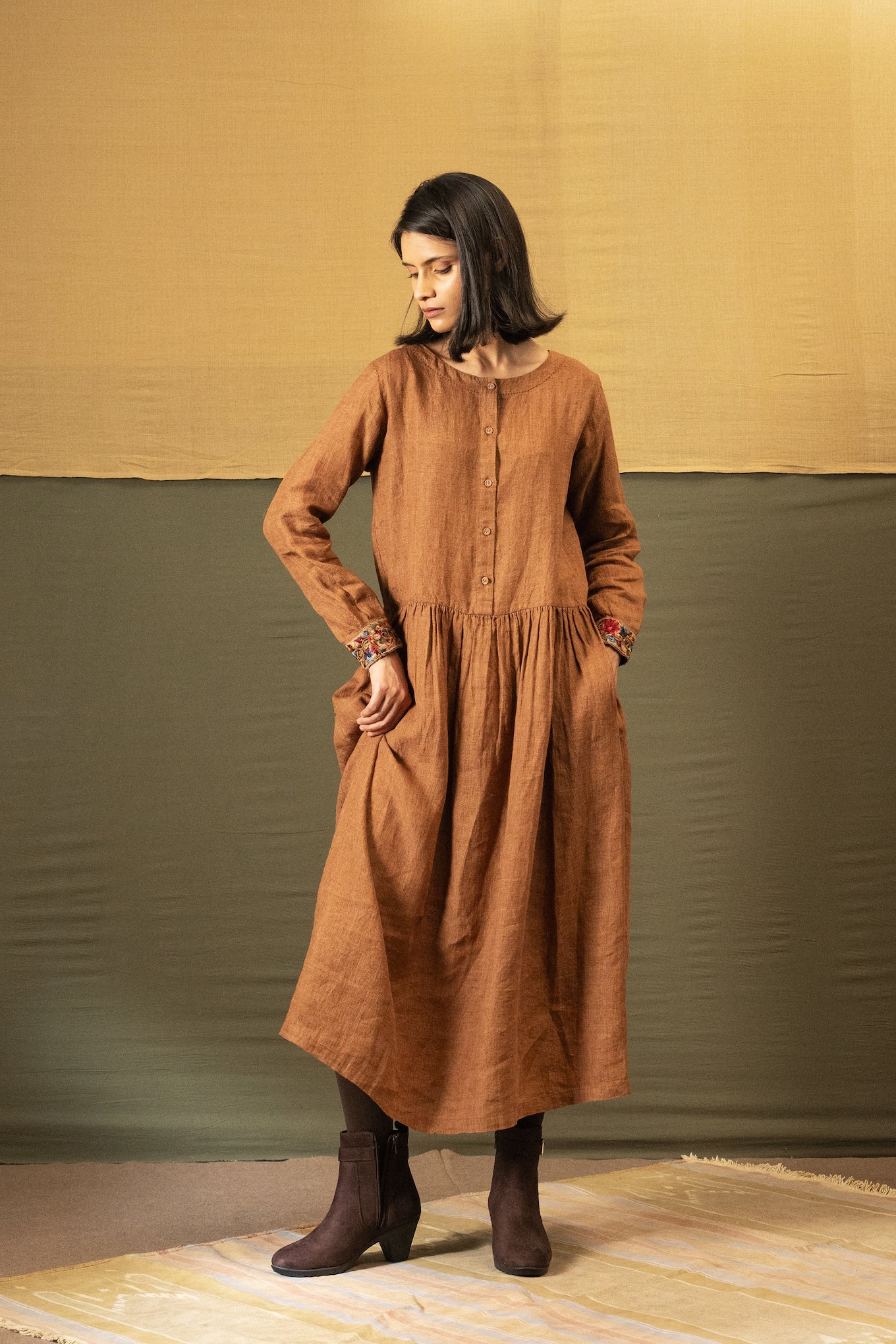 DVE Reeva dress in French beige linen with braid trim.
