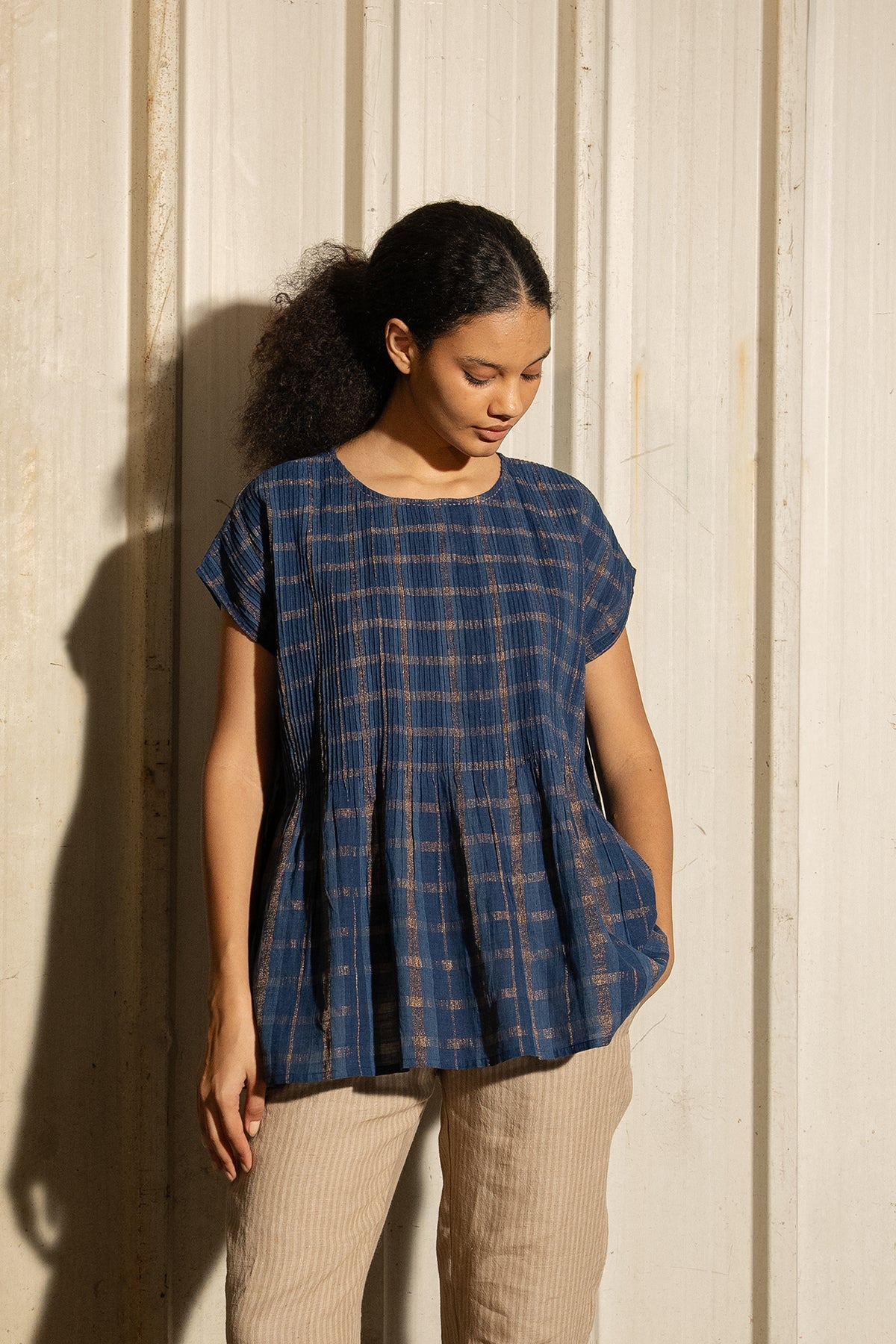 DVE Divya pintucked top in checked handloom indigo check cotton with lurex stripe.