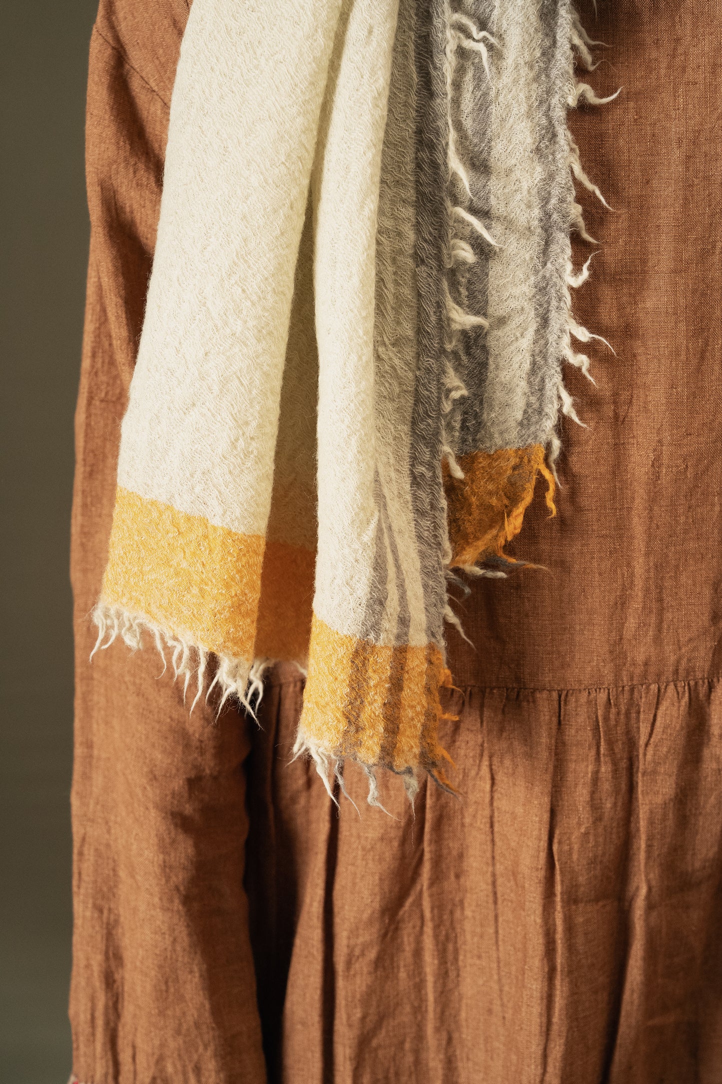 DVE Fine wool scarf in oyster grey, cream with mustard border.