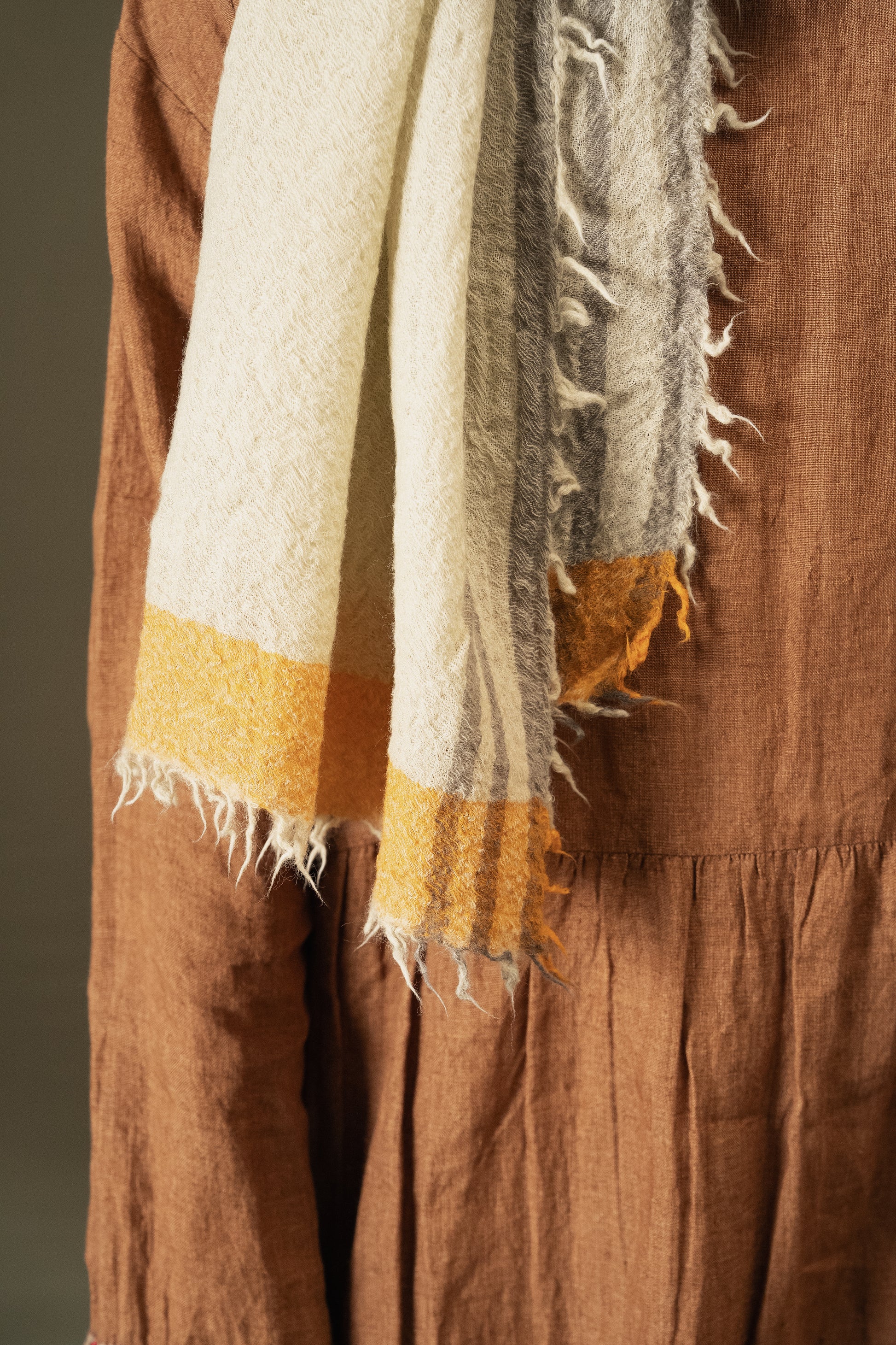 DVE Fine wool scarf in oyster grey, cream with mustard border.