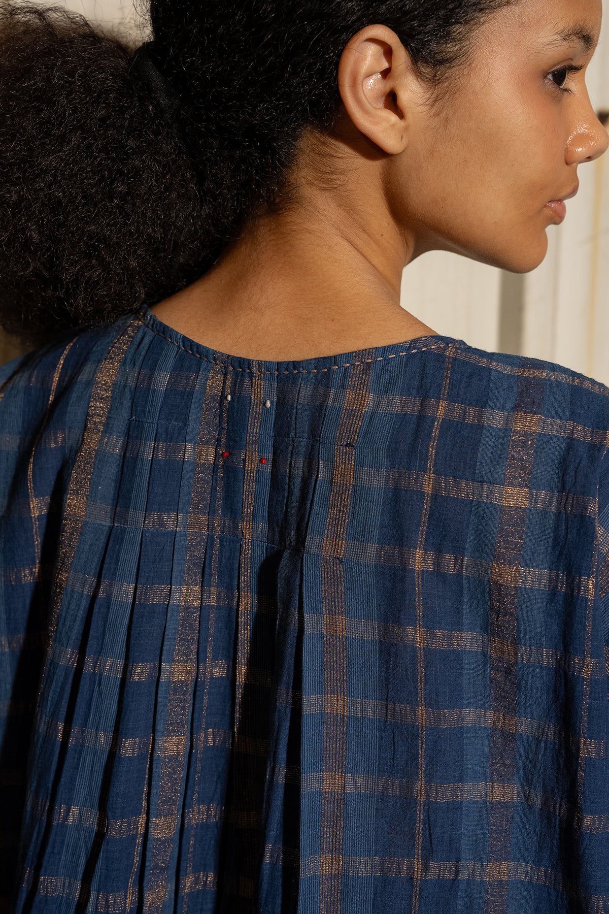 DVE Divya pintucked top in checked handloom indigo check cotton with lurex stripe.