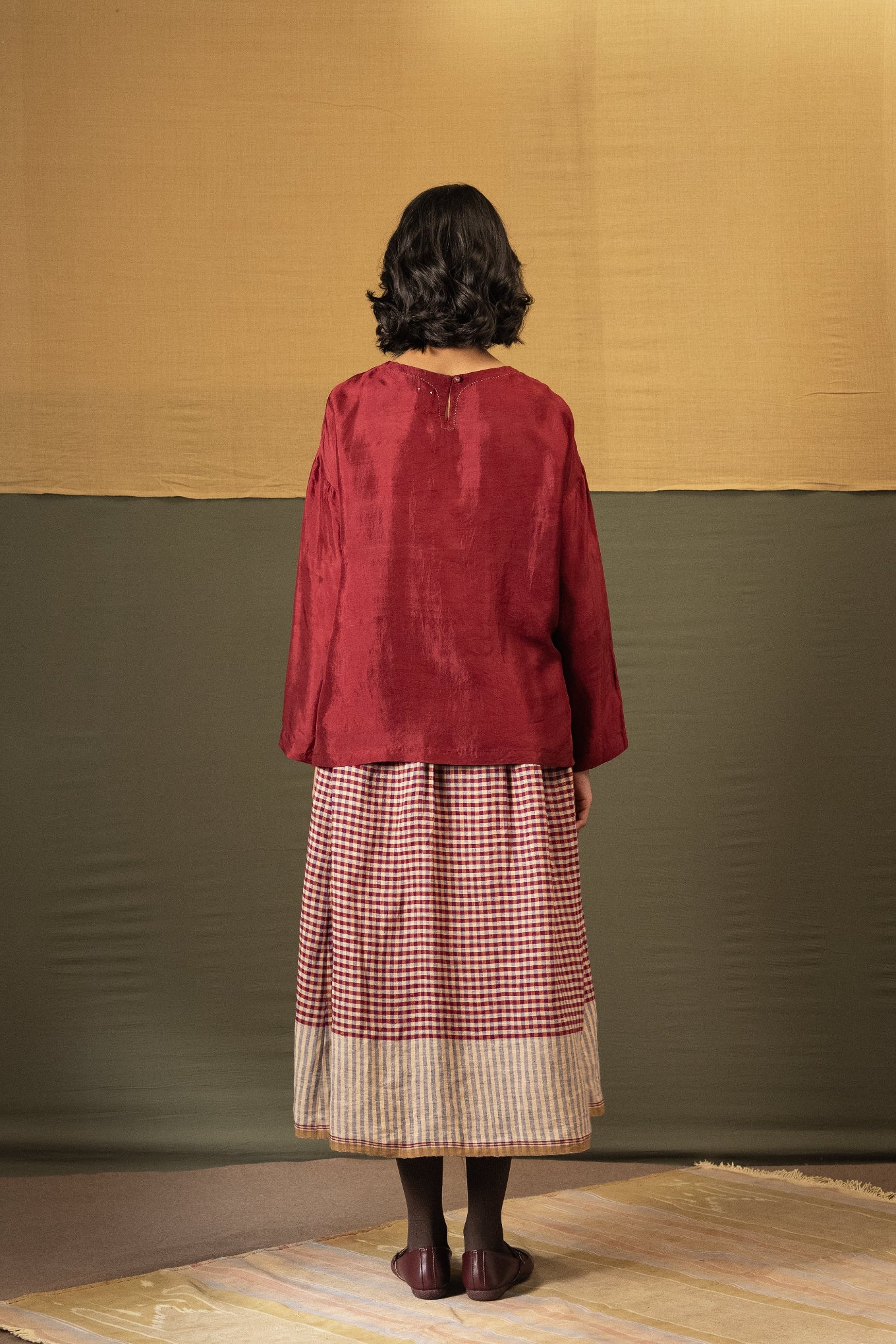 DVE Santati long sleeve round neck top in barn red handloom silk.