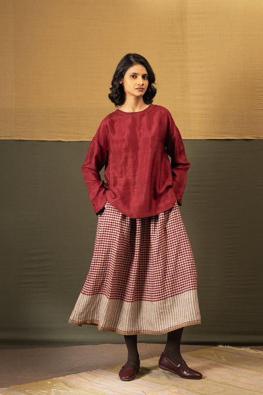 DVE Isha drawstring skirt in barn red linen gingham check with selvedge detail.