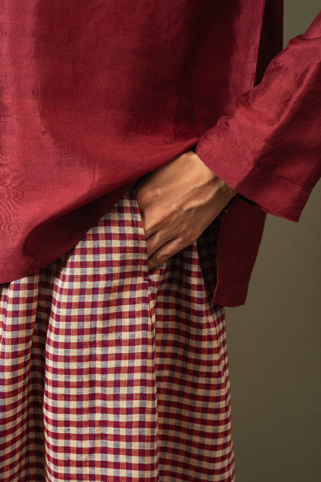DVE Isha drawstring skirt in barn red linen gingham check with selvedge detail.
