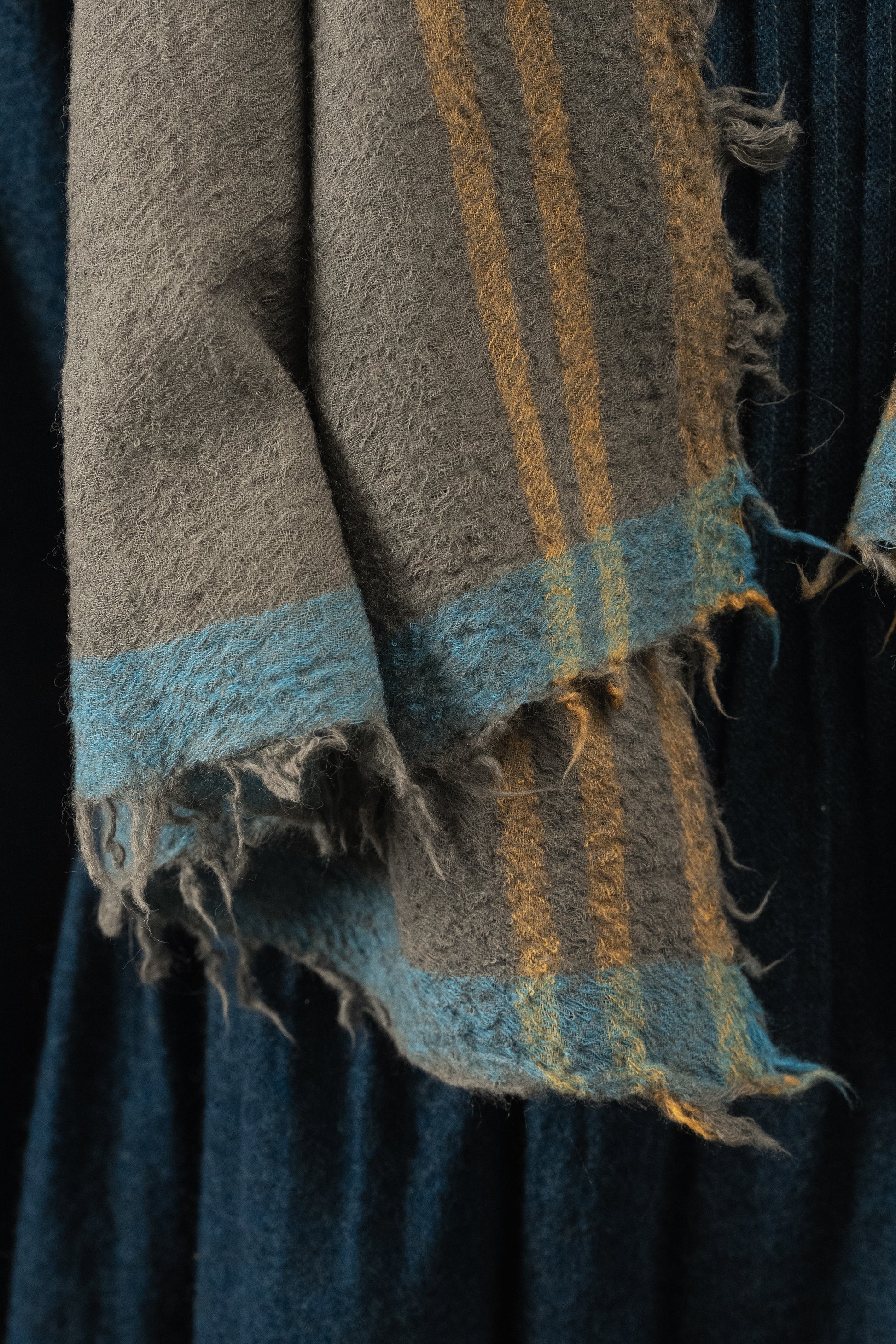 DVE Fine wool scarf in gunmetal grey with mustard and blue selvedge.