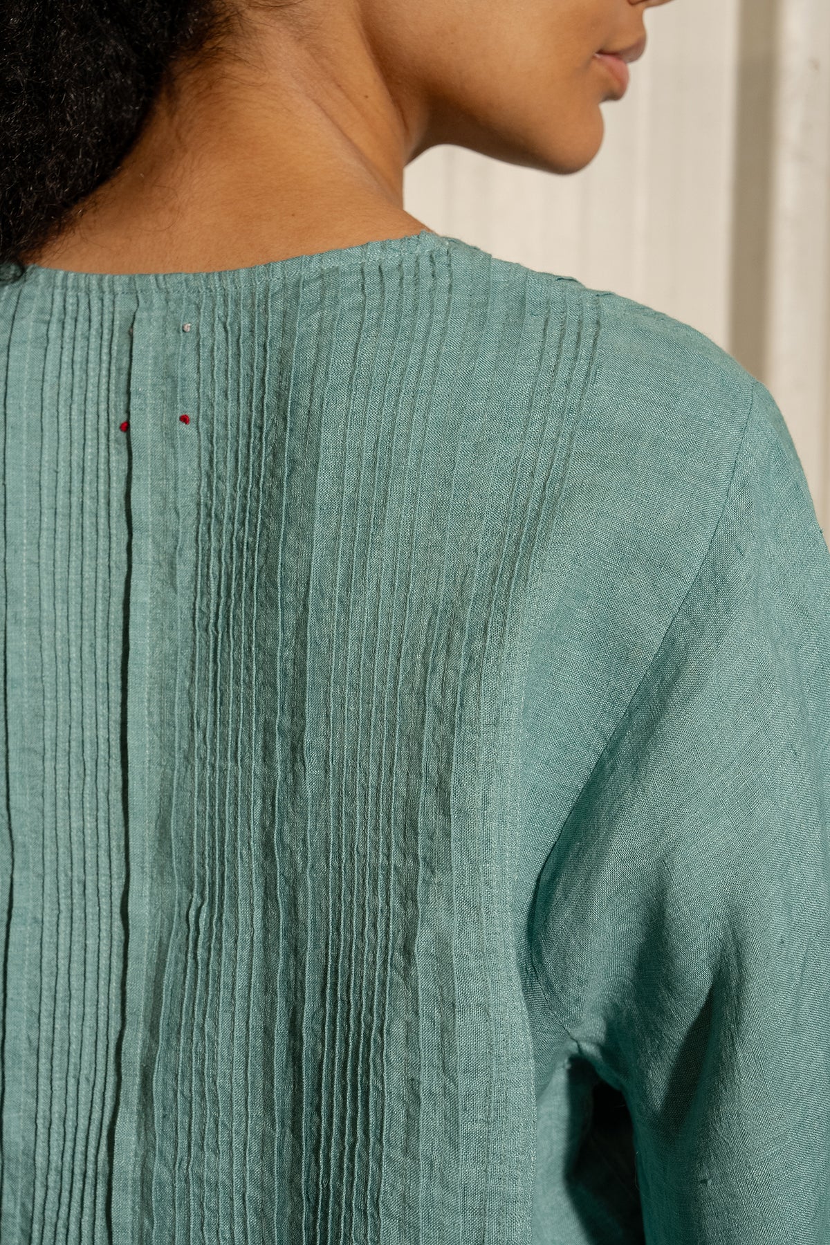 Dve Soma handloom linen pintuck 3/4 sleeve blouse in mineral green.