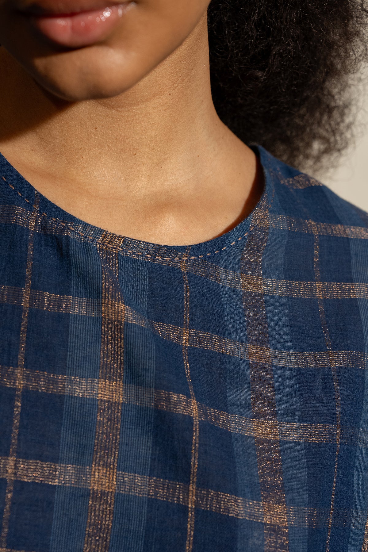 DVE Rayna dress in handloom indigo check cotton with subtle lurex stripe, cap sleeves and gathered skirt with side pockets.