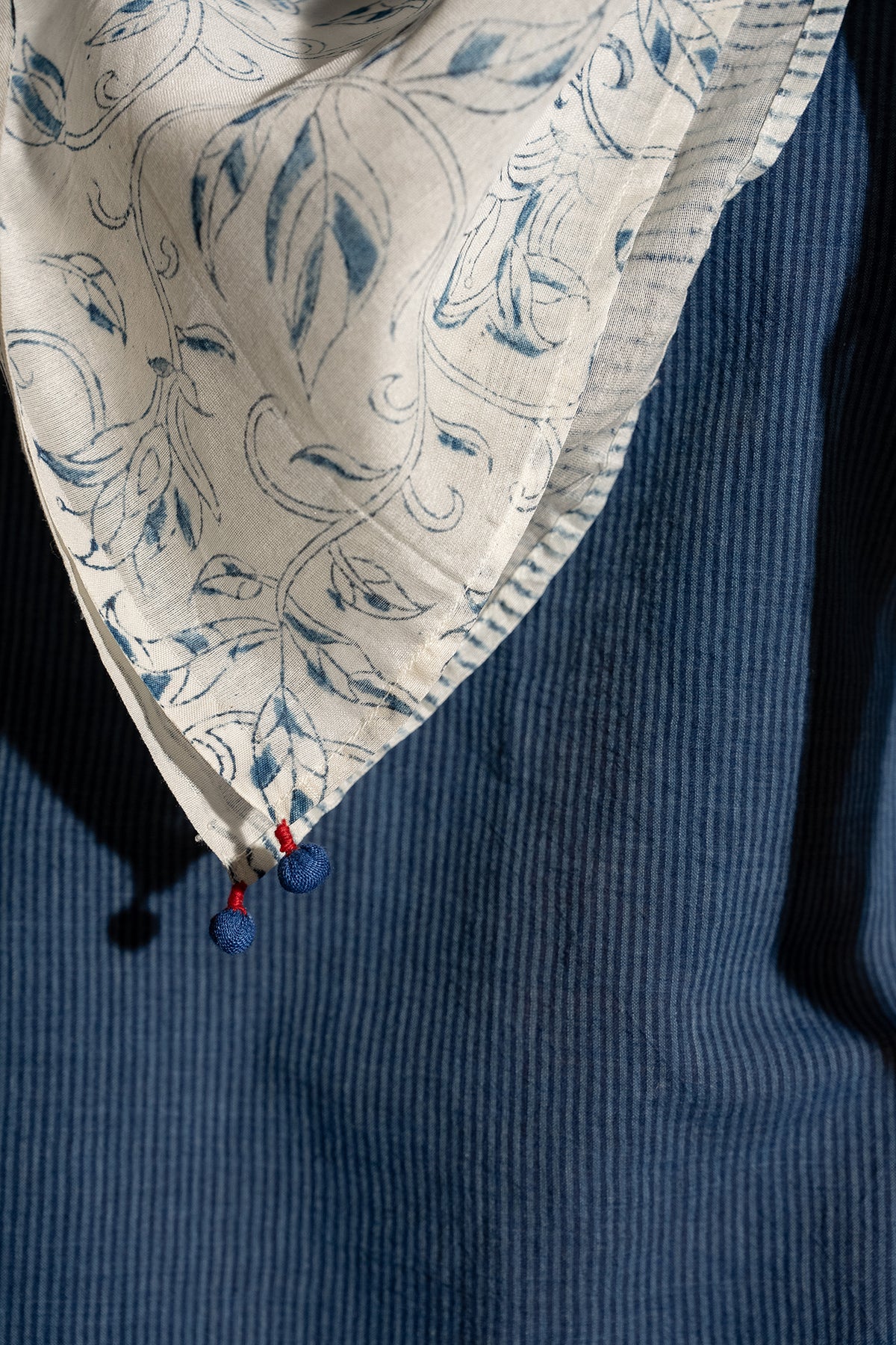 Dve cotton silk blockprinted square scarf with indigo floral and strip print on ecru base.
