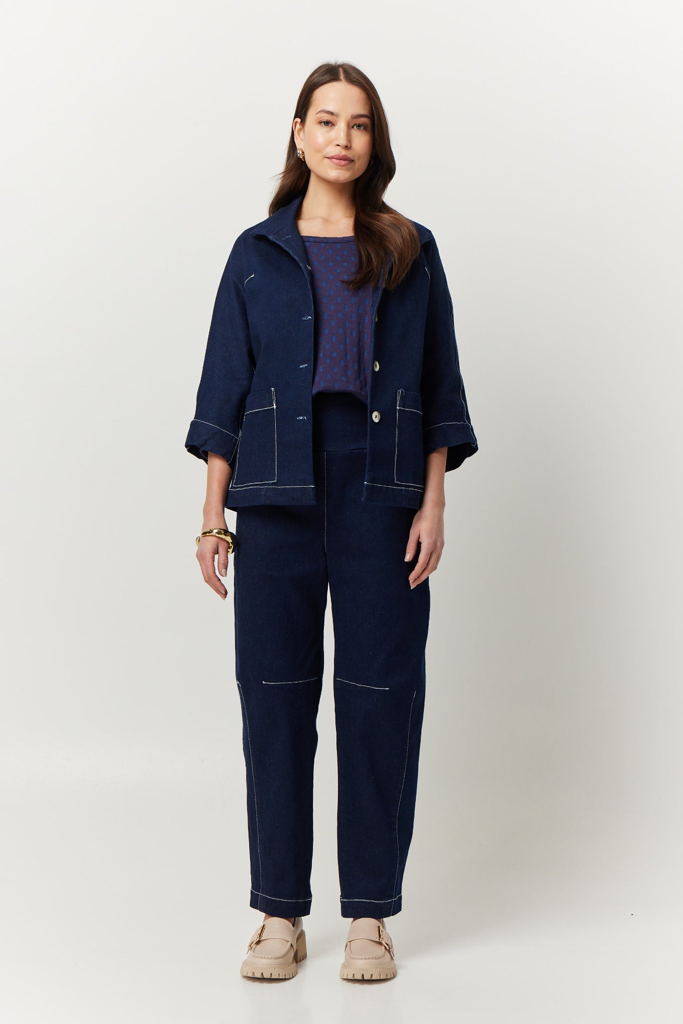 Valia Miro jacket in deep denim blue, feature top stitching.
