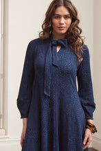 Load image into Gallery viewer, Valia made in Melbourne wool jacquard print fit and flare dress with tie at neck in deep navy ink.