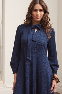 Valia made in Melbourne wool jacquard print fit and flare dress with tie at neck in deep navy ink.