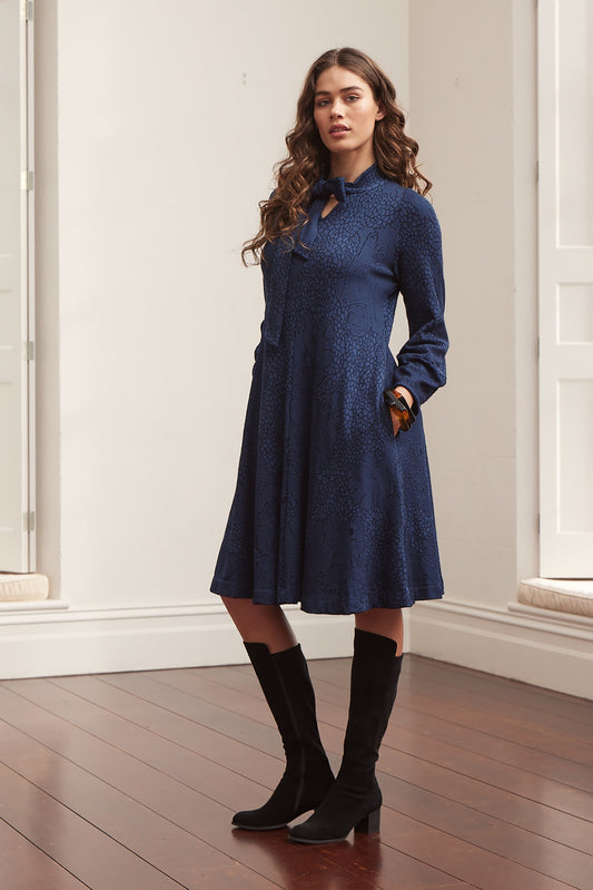 Valia made in Melbourne wool jacquard print fit and flare dress with tie at neck in deep navy ink.