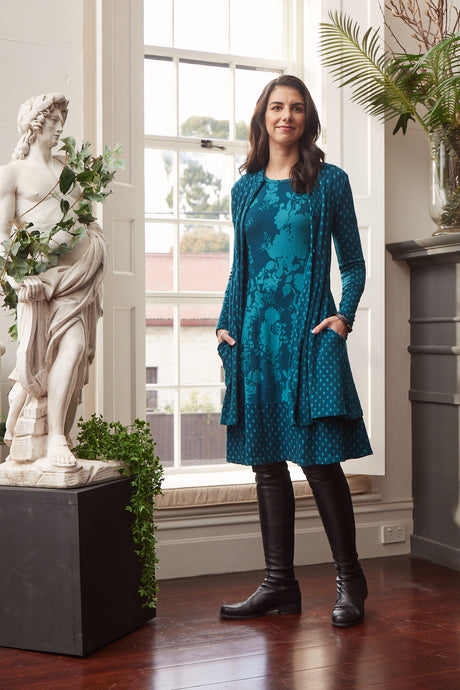 Valia Dixie dress in double weight wool jacquard floral print with spot border Brittany teal turquoise.