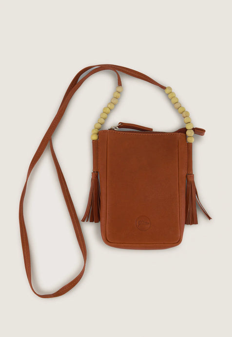 Nancybird Form pouch leather phone bag in pumpkin tan with beads and tassel detail.