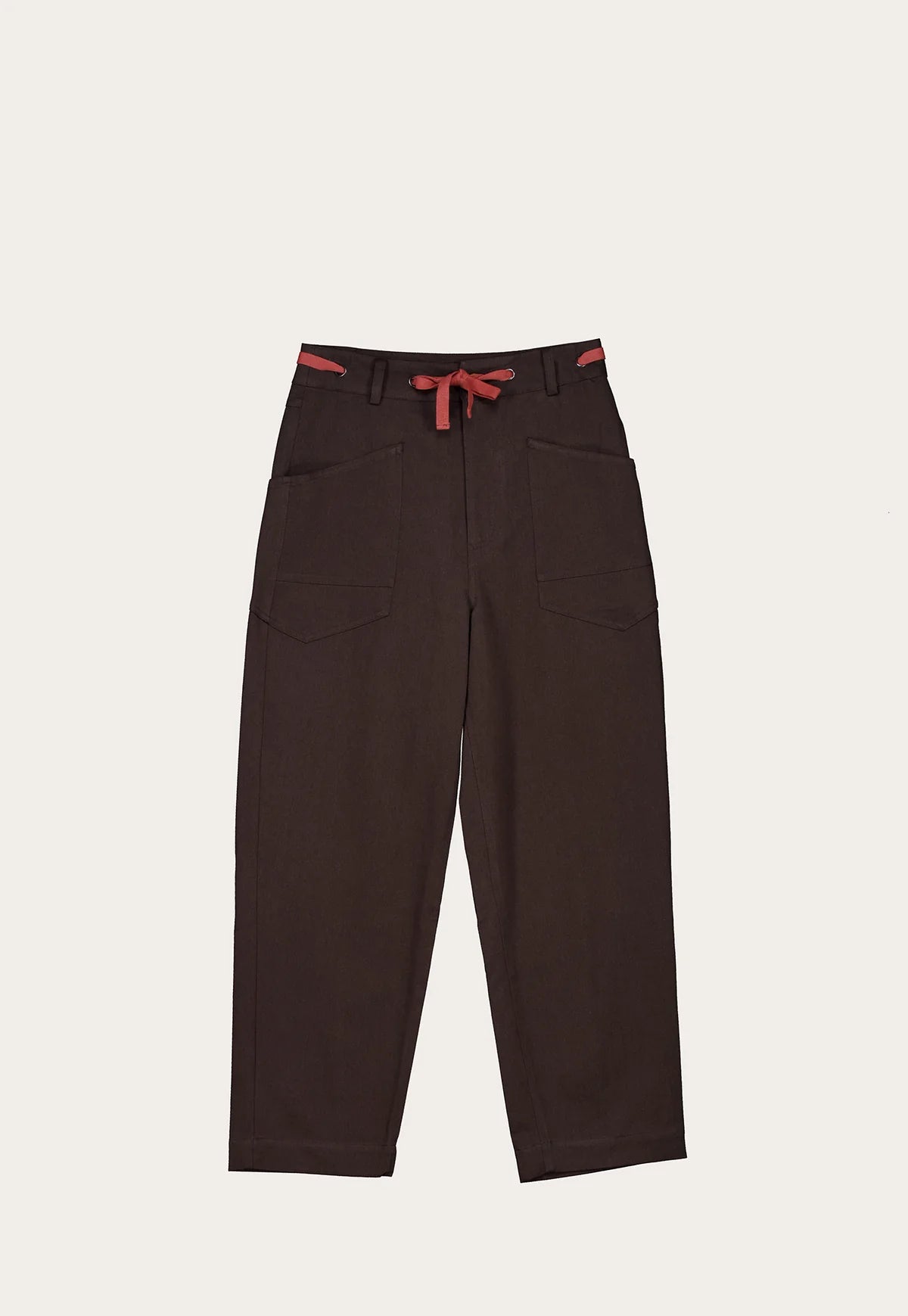 Nancybird Sera cotton linen blend brown pants with red accents on a light beige background.