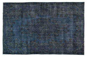 Vintage Turkish carpet floor rug distressed overdyed deep indigo blue.