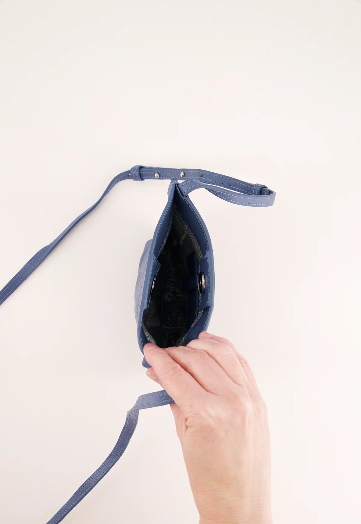 Nancybird Louanne pouch in vegetable tanned leather cross body mineral blue.