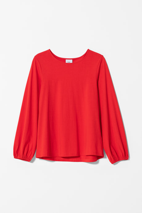 Elk Maja top, long sleeve t-shirt in tangerine organic cotton, full sleeve gathered at cuff can be worn pushed up.