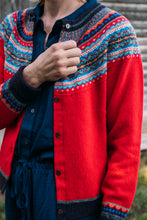 Load image into Gallery viewer, Eribe Alpine short cardigan in Crabapple, bright red with shades of blue and orange.