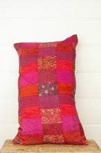 Load image into Gallery viewer, Juniper Hearth vintage silk kantha patchwork bolster cushion in shades of tangerine red orange, bright pink and floral print.