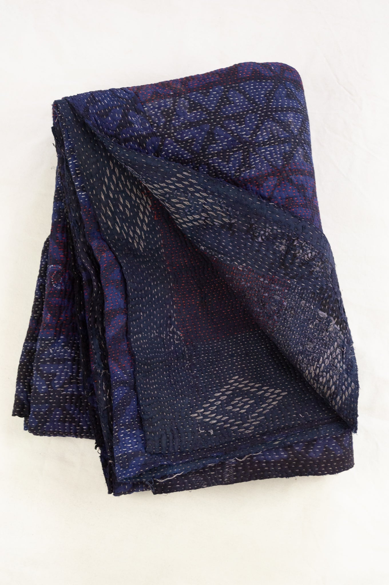 VIntage kantha quilt, overdyed in natural indigo using mud resist blockprint, inverted arrow pattern.