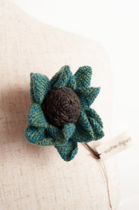 Sophie Digard brooch, made by hand in Madagascar, Asperule single flower crocheted in merino wool in deep turquoise with a chocolate brown centre.