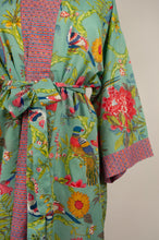 Load image into Gallery viewer, Cotton voile kimono robe dressing gown in aqua bird print with pink trim, detail showing pockets.