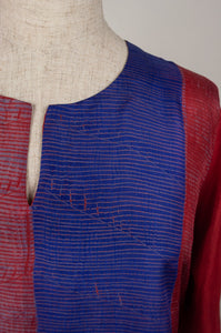 Pure silk shibori dyed silk kurta top in brick red and cobalt blue, neck detail.