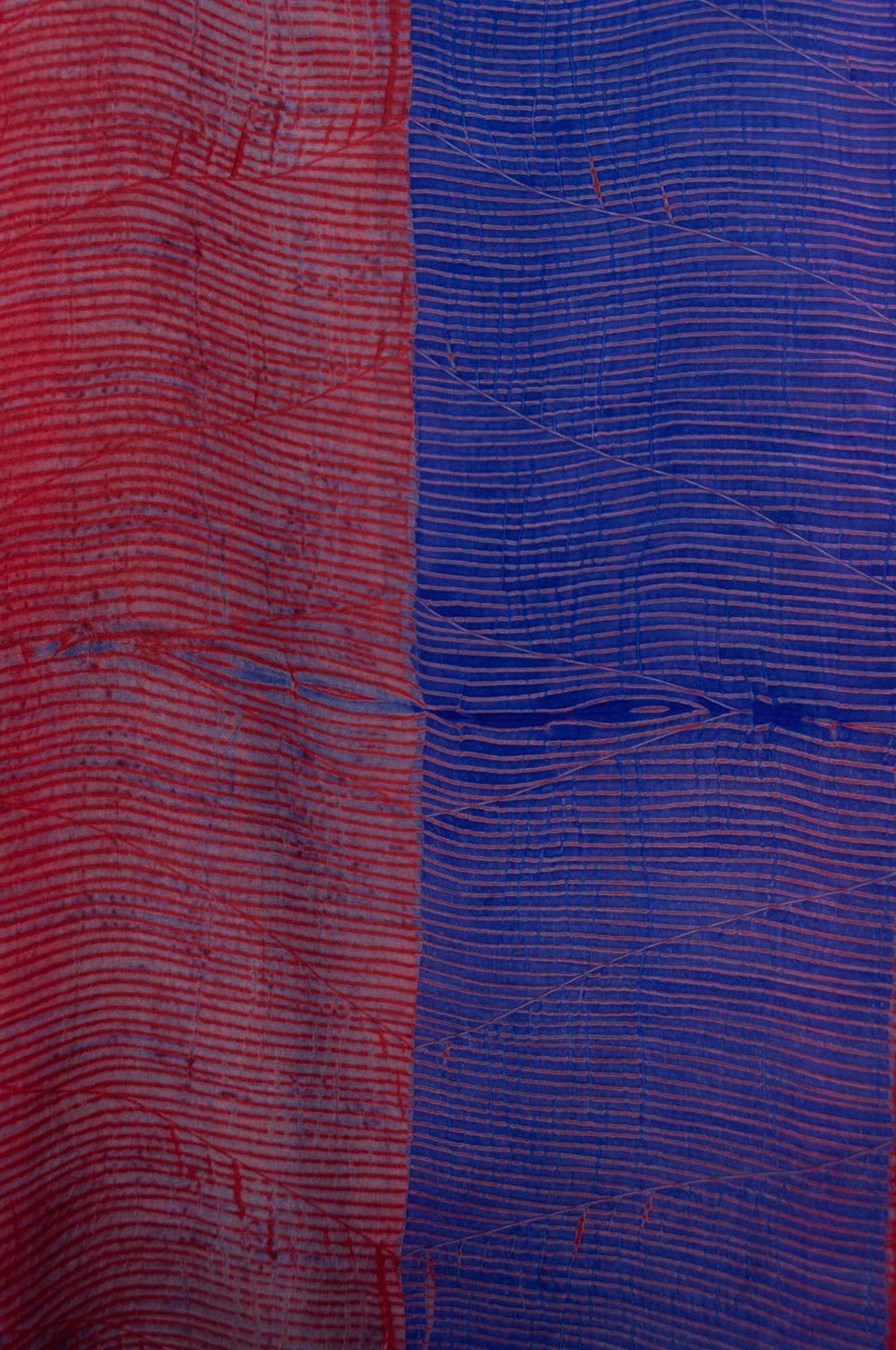 Pure silk shibori dyed silk kurta top in brick red and cobalt blue, fabric detail.