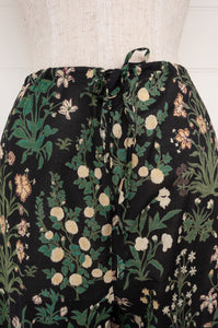 Juniper Hearth ethically made cotton voile full length pyjamas, beautiful vanilla and emerald green floral print on black background.