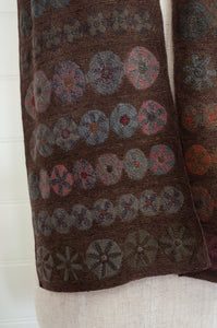 Sophie Digard Slow Sunday large crochet scarf in Dingle palette,multi-coloured flower medallions in navy, russet, charcoal and olive on rich chocolate brown.