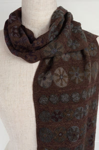 Sophie Digard Slow Sunday large crochet scarf in Dingle palette,multi-coloured flower medallions in navy, russet, charcoal and olive on rich chocolate brown.