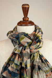 Létol French organic cotton scarf with a geometric Missoni inspired design in shades of red, green, gold, blue and black.